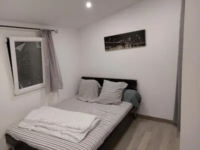 a small bed in a room with a window at Studio à louer sur Miramas in Miramas