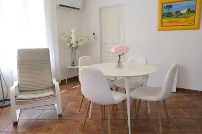 a white dining room with a table and chairs at Three bedrooms apartment in Aix en Pce in Aix-en-Provence