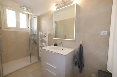 a bathroom with a sink and a shower and a mirror at Three bedrooms apartment in Aix en Pce in Aix-en-Provence