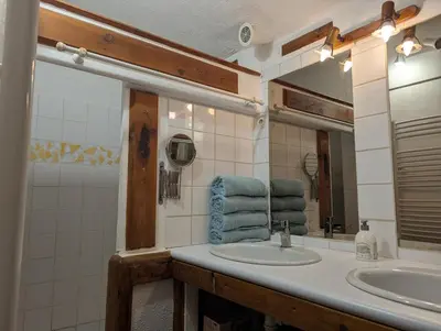 a bathroom with a sink and a mirror at La Bergerie de Lorette - Au Cœur du Luberon in Bonnieux