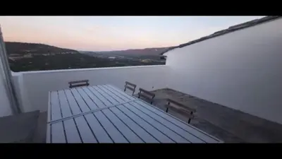 a balcony with two benches on top of a building at Lubéron Grde Maison de village avec terrasse 4 chambres doubles in Saint-Martin-de-Castillon
