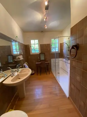 a bathroom with a shower and a sink and a tub at Les Mourguettes maison familiale avec piscine et garage sur 2000 m2 de terrain en campagne in Carpentras
