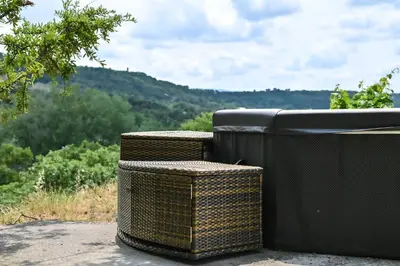 three wicker trash cans sitting on top of a hill at Maison provençale avec piscine et vue in Viens
