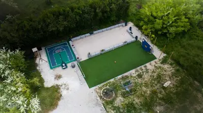 an aerial view of a large house with a golf court at La Maison PP une Parenthèse Provençale in Carpentras