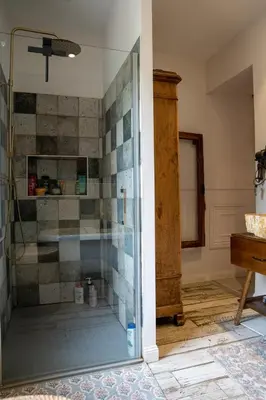 a shower with a glass door in a bathroom at La Maison PP une Parenthèse Provençale in Carpentras