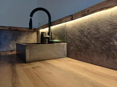 a kitchen with a sink and a wooden floor at Maison privée billard spa dans village du Luberon in Cabrières-dʼAigues