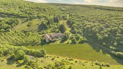 an aerial view of a house in the middle of a field at Hameau de l'Esperelle in Simiane-la-Rotonde