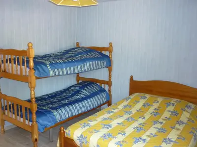 a bedroom with two bunk beds and a bed at Gite PROVENCE MONT VENTOUX in Malemort-du-Comtat