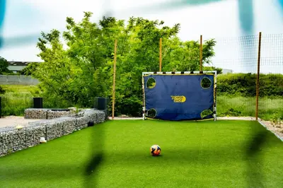 a soccer ball sitting on the grass in a field at La Maison PP - Appartements in Carpentras