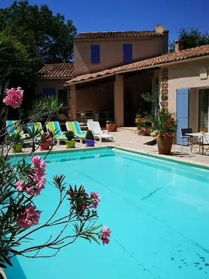 a swimming pool in front of a house at Chambre d'hôte à Pierrevert, en Haute Provence in Pierrevert
