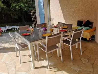a dining room table with chairs and a table and a table and chairsktop at Chambre d'hôte à Pierrevert, en Haute Provence in Pierrevert