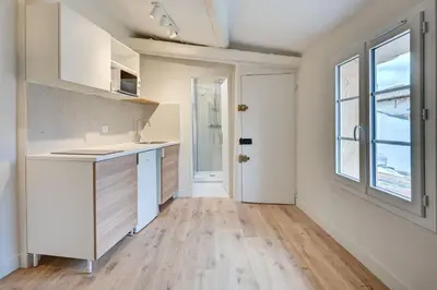 an empty kitchen with a sink and a window at New! Le zola studio lumineux en centre ville in Aix-en-Provence