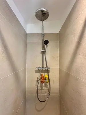 a shower in a bathroom with a shower head at Charmant T2 à deux pas du cours Mirabeau in Aix-en-Provence