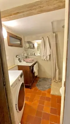 a small bathroom with a sink and a shower at La Mistraline, in the center of the Luberon, Provence 2 bedroom, 2 bath Village House in Caseneuve