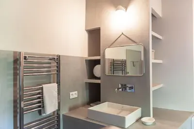 a bathroom with a sink and a mirror at Chez Marthe - Maison de village - Ménerbes centre in Ménerbes
