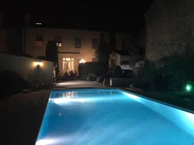 an empty swimming pool at night with a house at Bourgeois House - 16 personnes, Piscine, 6 chambres, 8 lits, 4 SDB, Centre-ville, CLIM in Salon-de-Provence