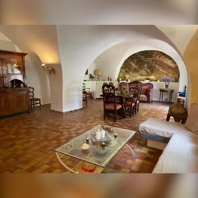 a living room with a couch and a table at Bastide de Bénezet in Mérindol