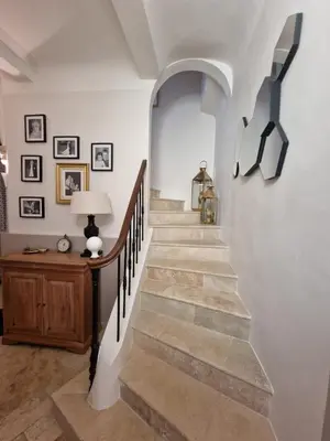 a staircase in a home with a stair case at Magnifique maison de ville avec piscine au cœur de la Provence in Salon-de-Provence