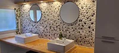 a bathroom with two sinks and two mirrors at Appartement de la Villa Del Sol in Pierrevert