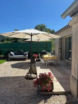 a patio with a table and an umbrella at 
