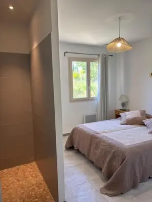a bedroom with a bed and a shower at 