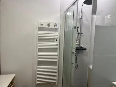 a bathroom with a shower with a glass door at Mas des trois sautets in Meyreuil