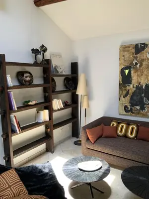 a living room with a couch and a table at Maisonnette de charme 60m2 in Robion en Luberon