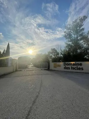 a tiny house with a porch and a deck at mobil home AU SOLEIL in La Roque-dʼAnthéron