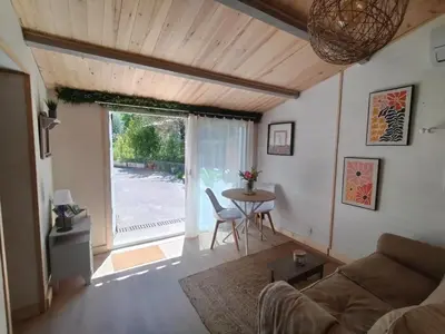 a living room with a couch and a table at La Ch'tite Maison in Céreste