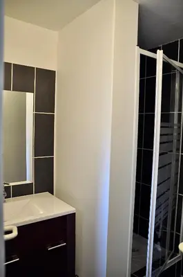a bathroom with a sink and a mirror at La parenthèse sur la sorgue in LʼIsle-sur-la-Sorgue