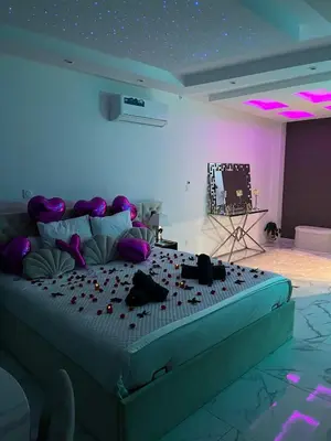 a bedroom with a large bed with lights on it at Trésor Étoile, luxe & lumière - Duplex 4 personnes in Pertuis