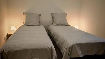 two beds sitting next to each other in a bedroom at Cap sur le Ventoux in Mormoiron
