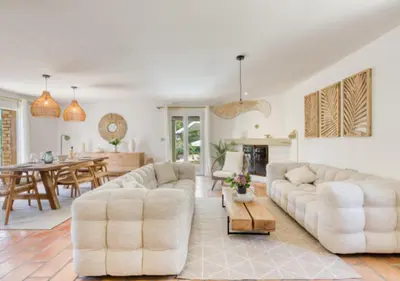 a living room with two white couches and a table at Villa La Belle Vie in Gordes