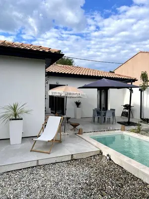 a house with a swimming pool and a patio at Villa rosalie L'Isle-sur-la-Sorgue in LʼIsle-sur-la-Sorgue