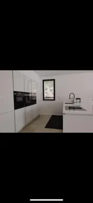 a white bathroom with a sink and a window at Villa contemporaine de luxe in Aix-en-Provence