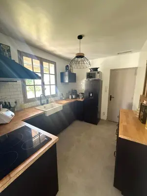a kitchen with a sink and a counter top at La Tobynette in LʼIsle-sur-la-Sorgue