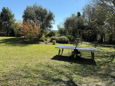 a swing set in the middle of a yard at Bastide Neuve au Cœur du Luberon - Piscine Privée in Lauris