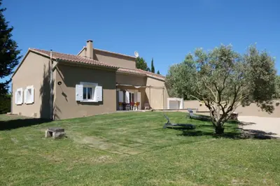a house with a tree in the yard at Villa overlooking the Alpilles Saint Remy de Provence LS1-454 in Saint-Rémy-de-Provence