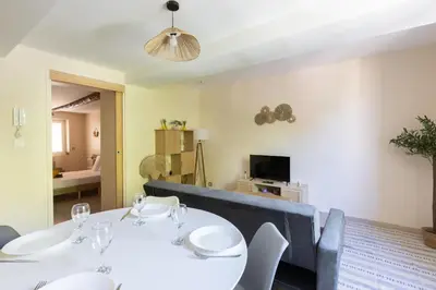 a dining room with two white tables and chairs at Le Lavandin - 3 to 4 beds - Hypercentre - Wifi in Apt