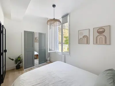 a white bedroom with a bed and a window at Côté Palmier - Luxurious 2-room - Center-by PauseAixoise in Aix-en-Provence