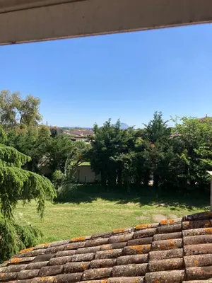 a view of a yard from the roof of a house at Grande maison avec piscine in Aix-en-Provence