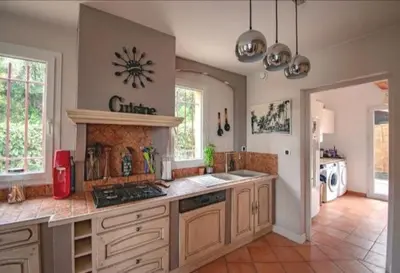 a kitchen with a sink and a counter top at Magnifique villa avec piscine à 2 pas du centre d'Aix in Aix-en-Provence