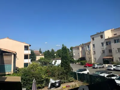 a view of a parking lot with cars parked at La Mazarine - Studio tout confort - Les Milles proche Aix TGV Marseille in Aix-en-Provence