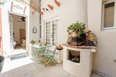 a wooden door with a metal latch on it at La Cour Secrète - Suite Riad Balnéo privé Carpentras in Carpentras