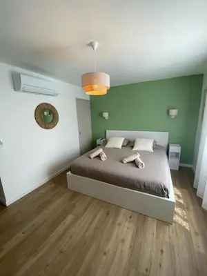 a bedroom with a bed with two towels on it at Maison Aix-en-Provence in Aix-en-Provence