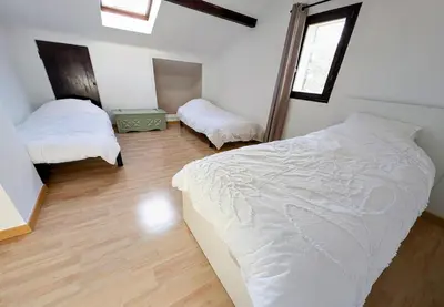 a bedroom with two beds with white sheets at Villa 7 chambres, piscine et jardins privés, pas de voisins in Le Thor