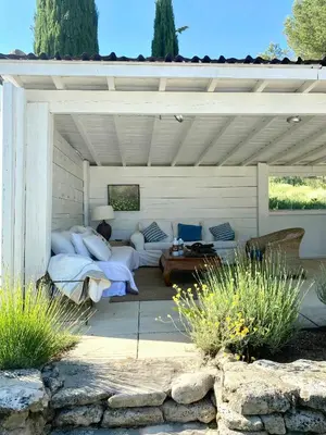 a living room with couches and a patio at Provencal Villa With Panoramic Views In Luberon in Apt