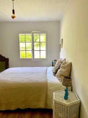 a bedroom with a white bed and a window at Provencal Villa With Panoramic Views In Luberon in Apt