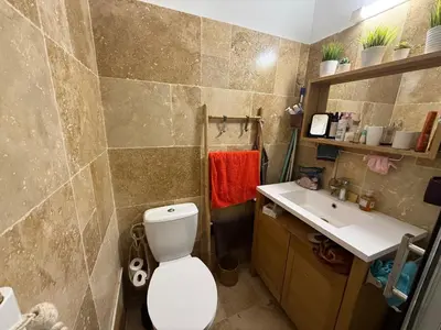a bathroom with a toilet and a sink at Cabanon Lourmarin in Lourmarin