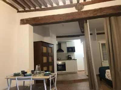 a kitchen and dining room with a table and chairs at Plaisir de vacances in Aix-en-Provence